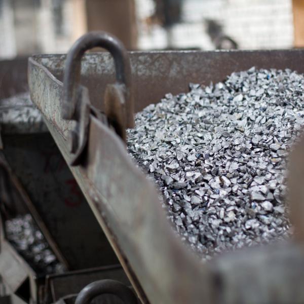 Pieces of ferrotitanium closeup. Ferroalloy used for alloying, deoxidation and degassing of steels and alloys