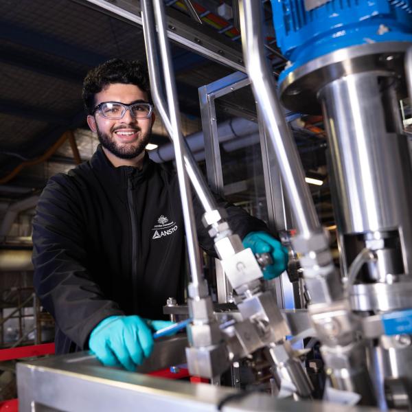 ANSTO staff member at Auto Clave machinery in Minerals pilot plant