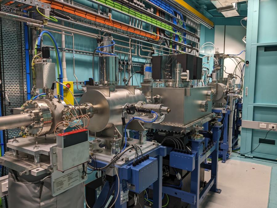 Some of MX'3 optics, large silver vacuum vessels on granite blocks for precise positioning
